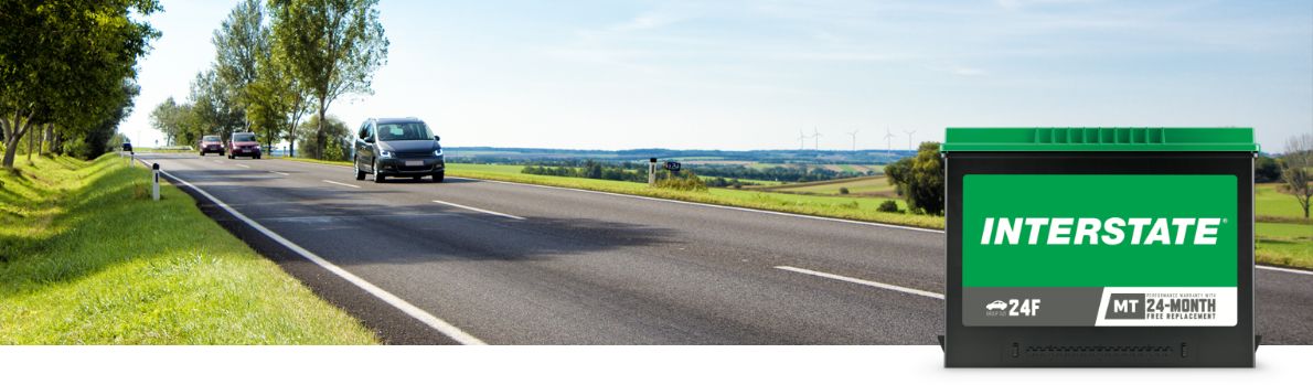 Vehicle driving down highway with Interstate battery